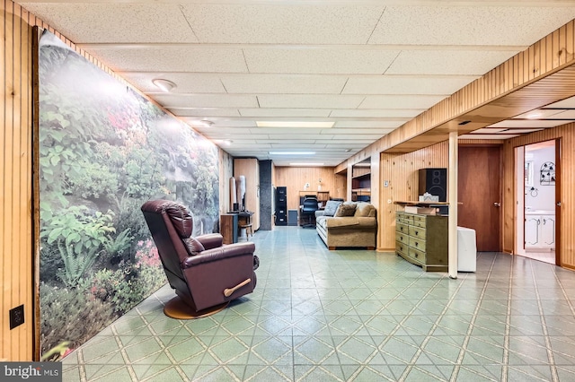 12105 Lanham Severn Rd, Bowie, MD 20720 - living area featuring tile patterned floors, wood walls, and a paneled ceiling