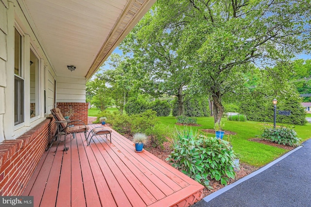 12105 Lanham Severn Rd, Bowie, MD 20720 - deck featuring a lawn and view of wooded area