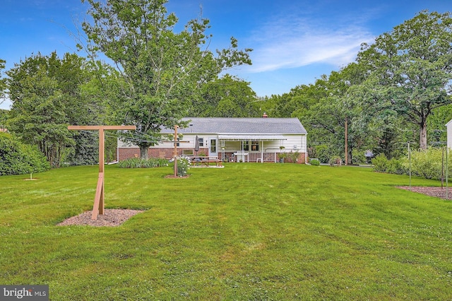 12105 Lanham Severn Rd, Bowie, MD 20720 - rear view of property featuring a yard and brick siding