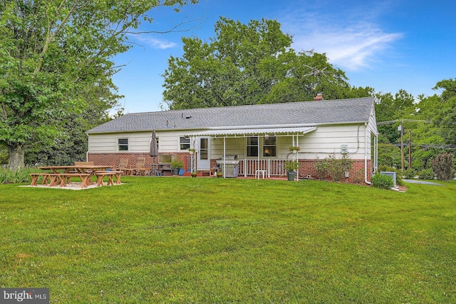 12105 Lanham Severn Rd, Bowie, MD 20720 - back of house featuring a yard, brick siding, and a shingled roof