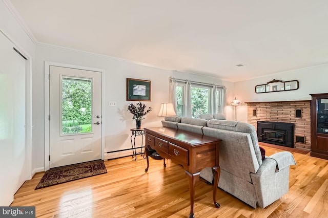 12105 Lanham Severn Rd, Bowie, MD 20720 - living room featuring a baseboard radiator, healthy amount of natural light, light wood-style flooring, crown molding, and a fireplace with flush hearth