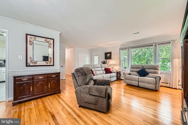 12105 Lanham Severn Rd, Bowie, MD 20720 - living area featuring light wood-style flooring and crown molding