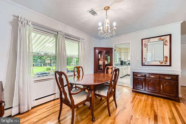 12105 Lanham Severn Rd, Bowie, MD 20720 - dining room with a chandelier, light wood-type flooring, ornamental molding, and baseboard heating
