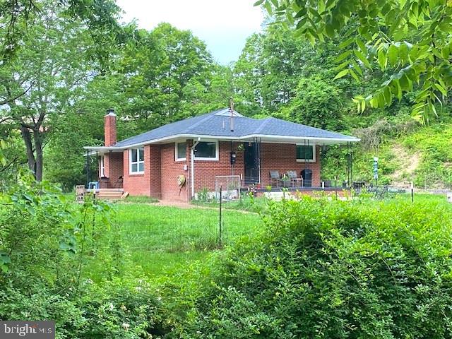 12809 Ballfield Rd NE, Little Orleans, MD 21766 - view of front facade featuring a chimney and brick siding