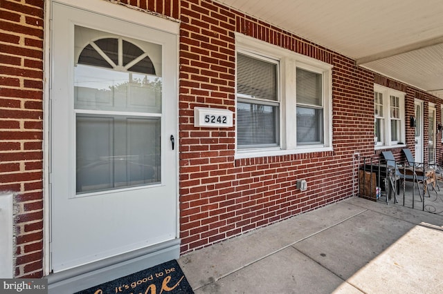 5242 Sylvester St, Philadelphia, PA 19124 - property entrance with a porch and brick siding