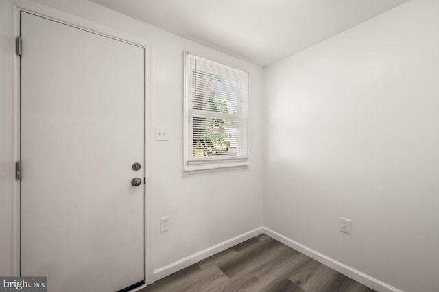 5242 Sylvester St, Philadelphia, PA 19124 - entryway with dark wood-type flooring and baseboards