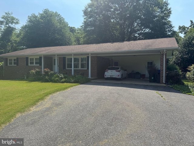8070 Wheatley Rd, La Plata, MD 20646 - ranch-style house with asphalt driveway, a front yard, an attached carport, and brick siding