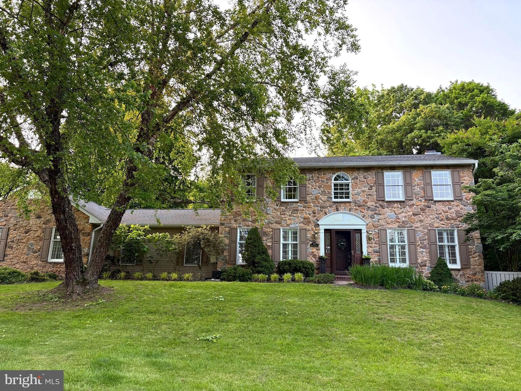 333 Huffman Dr, Exton, PA 19341 - colonial home featuring stone siding and a front lawn