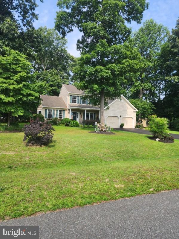 71 Gardenia Blvd, Greenwood, DE 19950 - view of front of property featuring a front yard, asphalt driveway, and an attached garage