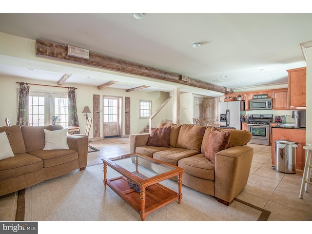 2103 Street Rd, New Hope, PA 18938 - living area with light tile patterned floors, stairs, and recessed lighting