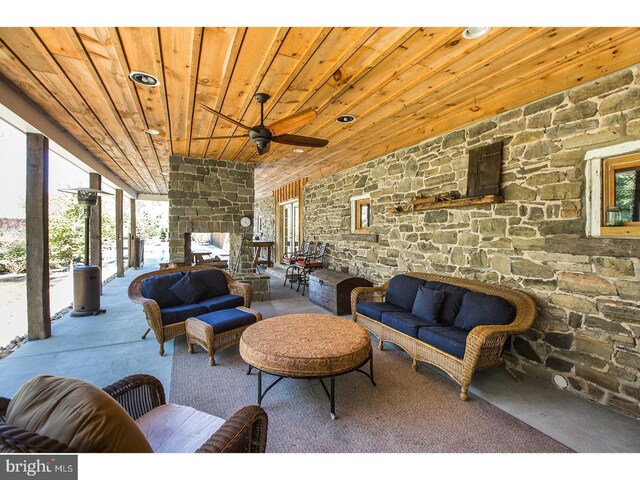 2103 Street Rd, New Hope, PA 18938 - living room featuring wood ceiling, a ceiling fan, plenty of natural light, and a multi sided fireplace