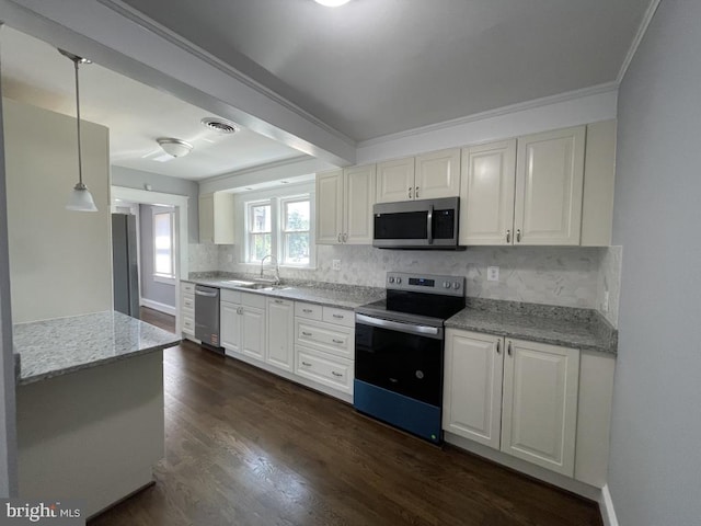 309 Progress St, Fredericksburg, VA 22401 - kitchen with appliances with stainless steel finishes, tasteful backsplash, light stone countertops, dark wood-style floors, and pendant lighting