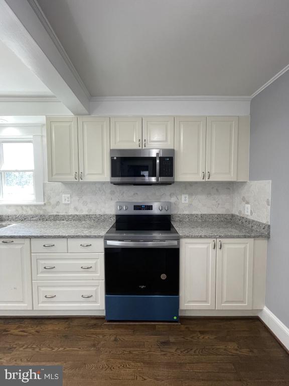 309 Progress St, Fredericksburg, VA 22401 - kitchen with appliances with stainless steel finishes, ornamental molding, backsplash, dark wood-style flooring, and light stone counters