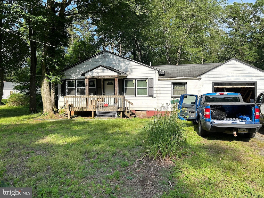 28 Cedar St, New Egypt, NJ 08533 - view of front facade featuring a front lawn and an attached garage