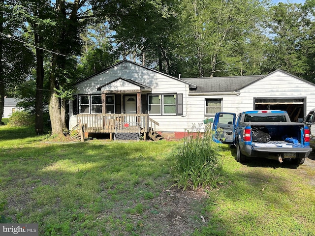 28 Cedar St, New Egypt, NJ 08533 - view of front facade featuring a front lawn and an attached garage
