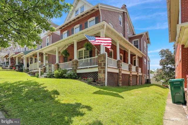 120 Hook St, Birdsboro, PA 19508 - view of front of house with brick siding, a porch, and a front lawn