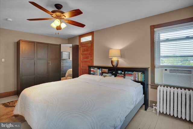 120 Hook St, Birdsboro, PA 19508 - bedroom with radiator, a ceiling fan, and light wood-style floors