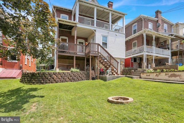 120 Hook St, Birdsboro, PA 19508 - back of house with stairway, a lawn, a fire pit, and a chimney