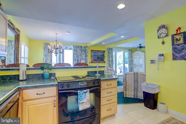 6180 Marsh Island Dr, Chincoteague Island, VA 23336 - kitchen with electric range, light tile patterned floors, a chandelier, light brown cabinetry, and dark countertops