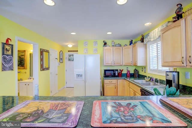 6180 Marsh Island Dr, Chincoteague Island, VA 23336 - kitchen with white refrigerator with ice dispenser, black microwave, light brown cabinets, recessed lighting, and dark countertops