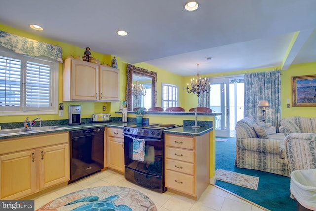 6180 Marsh Island Dr, Chincoteague Island, VA 23336 - kitchen featuring black appliances, a peninsula, light brown cabinetry, dark countertops, and recessed lighting