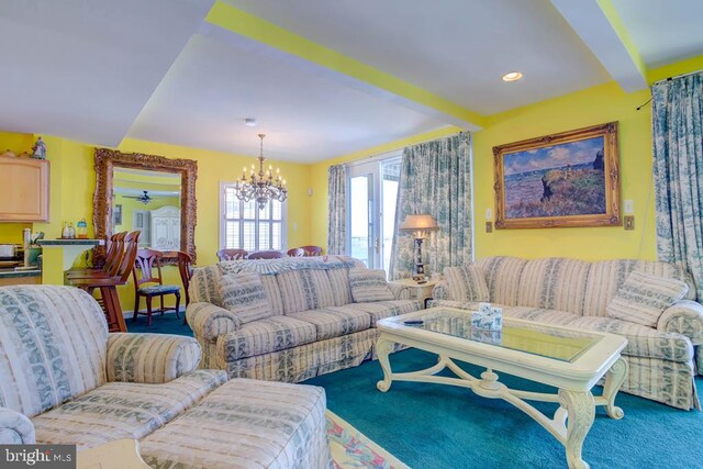 6180 Marsh Island Dr, Chincoteague Island, VA 23336 - carpeted living room with a chandelier and beamed ceiling