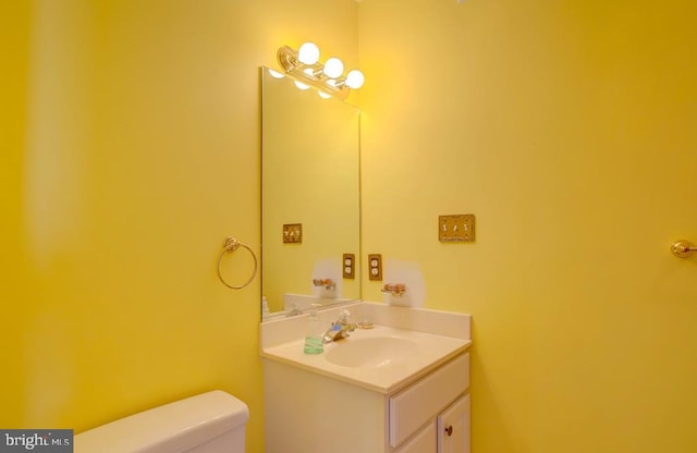 6180 Marsh Island Dr, Chincoteague Island, VA 23336 - half bathroom with vanity and toilet
