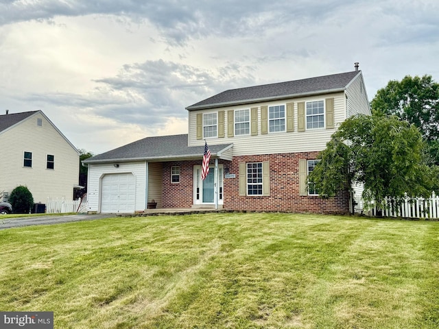 2575 Romig Rd, Gilbertsville, PA 19525 - view of front of home featuring a garage, asphalt driveway, and brick siding