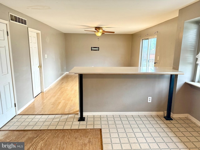 2575 Romig Rd, Gilbertsville, PA 19525 - kitchen with ceiling fan and a peninsula