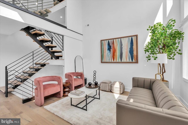2618 E Hagert St, Philadelphia, PA 19125 - living room featuring wood finished floors, stairway, and a towering ceiling