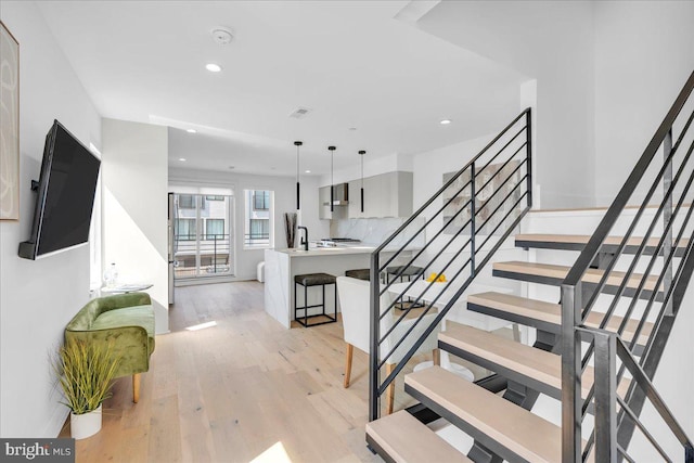 2618 E Hagert St, Philadelphia, PA 19125 - staircase featuring wood finished floors and recessed lighting