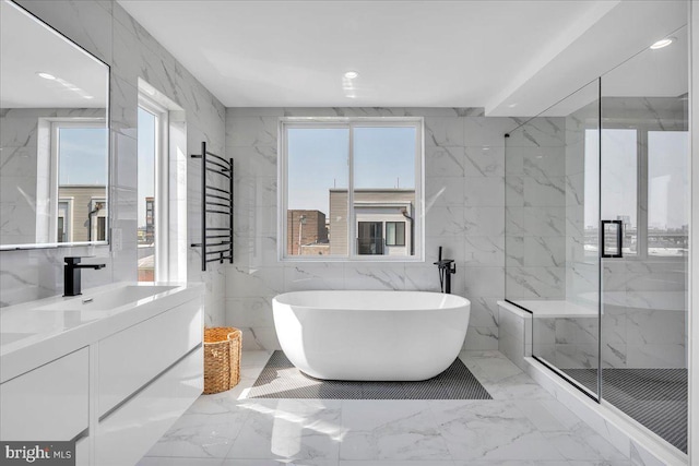 2618 E Hagert St, Philadelphia, PA 19125 - full bath with plenty of natural light, vanity, a soaking tub, a marble finish shower, and recessed lighting