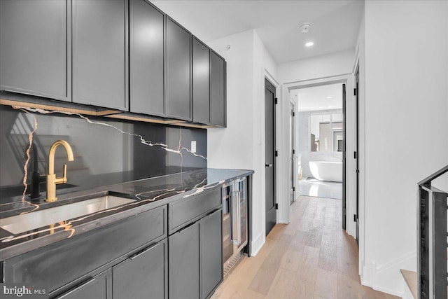 2618 E Hagert St, Philadelphia, PA 19125 - kitchen featuring gray cabinetry, light wood finished floors, recessed lighting, and decorative backsplash