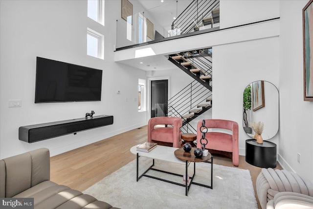 2618 E Hagert St, Philadelphia, PA 19125 - living room featuring wood finished floors, stairway, and a high ceiling