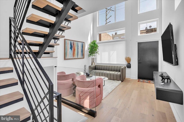 2618 E Hagert St, Philadelphia, PA 19125 - living room featuring a high ceiling, stairway, and hardwood / wood-style floors