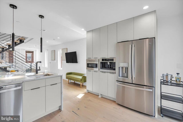 2618 E Hagert St, Philadelphia, PA 19125 - kitchen featuring appliances with stainless steel finishes, modern cabinets, light wood finished floors, white cabinetry, and recessed lighting