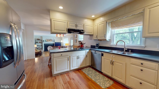 1047 Brookfield Cir, Quakertown, PA 18951 - kitchen featuring appliances with stainless steel finishes, dark countertops, light wood-style floors, and recessed lighting