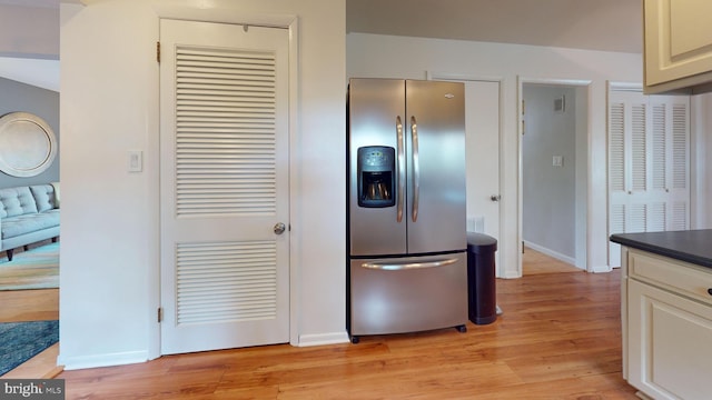 1047 Brookfield Cir, Quakertown, PA 18951 - kitchen featuring stainless steel refrigerator with ice dispenser, light wood-type flooring, and dark countertops