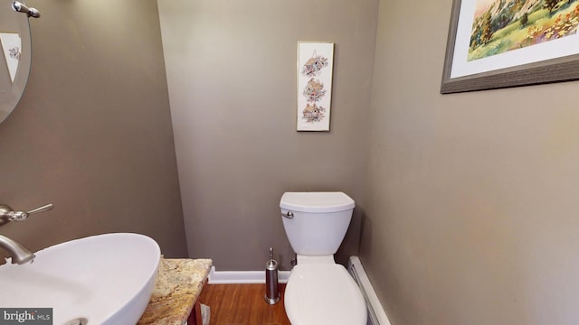 1047 Brookfield Cir, Quakertown, PA 18951 - bathroom featuring wood finished floors and baseboard heating