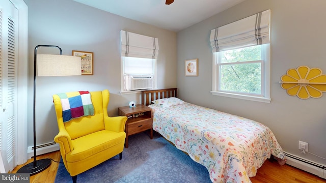 1047 Brookfield Cir, Quakertown, PA 18951 - bedroom with a baseboard heating unit, cooling unit, and a ceiling fan