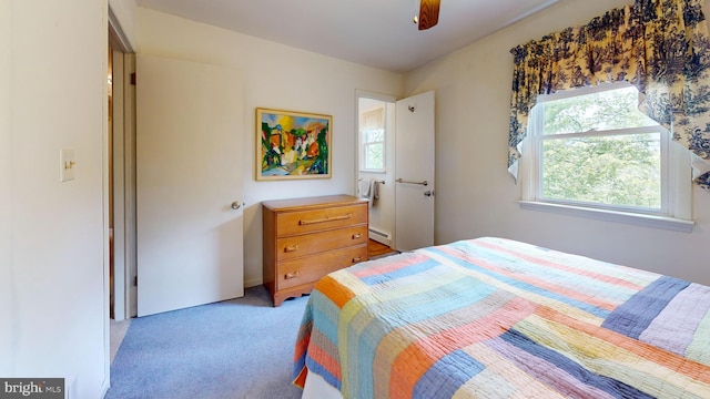 1047 Brookfield Cir, Quakertown, PA 18951 - bedroom with light carpet, a baseboard radiator, and a ceiling fan