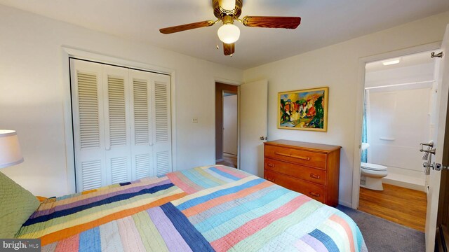 1047 Brookfield Cir, Quakertown, PA 18951 - carpeted bedroom featuring a closet, ensuite bath, and ceiling fan