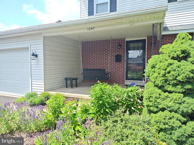 1047 Brookfield Cir, Quakertown, PA 18951 - property entrance with brick siding and a garage