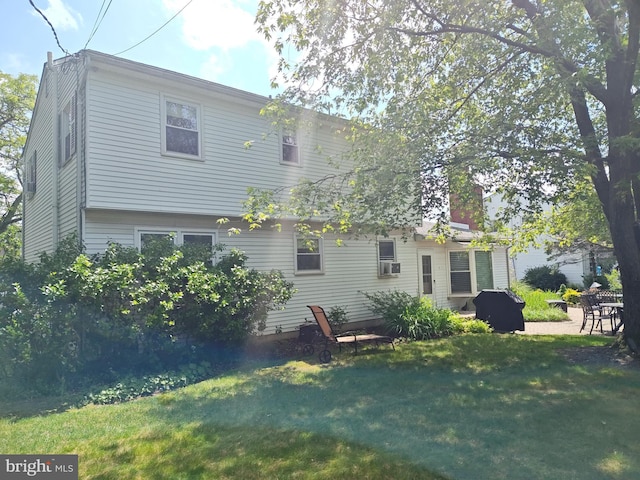 1047 Brookfield Cir, Quakertown, PA 18951 - rear view of property with a lawn and a chimney