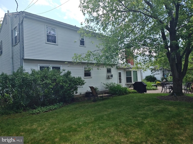 1047 Brookfield Cir, Quakertown, PA 18951 - rear view of house with a lawn and cooling unit