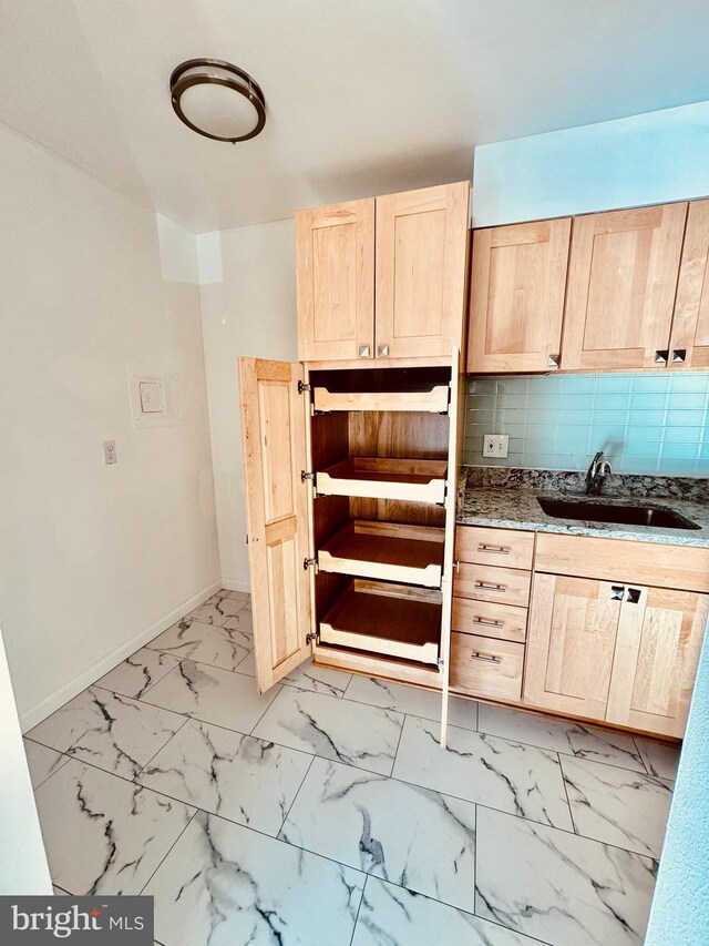2205 Greenery Ln Unit 104-9, Silver Spring, MD 20906 - kitchen with light brown cabinets, backsplash, light marble finish floors, and stone countertops