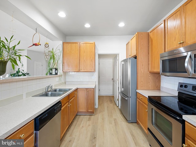 111 Sandridge Ct Unit 6-Jul, Millsboro, DE 19966 - kitchen featuring appliances with stainless steel finishes, decorative backsplash, light wood-style flooring, light countertops, and recessed lighting