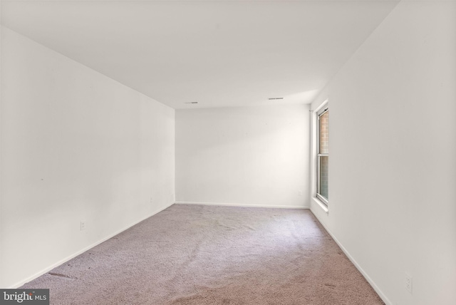 3378 Woodburn Rd Unit 11, Annandale, VA 22003 - carpeted spare room featuring baseboards