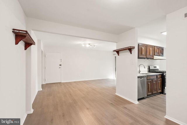 3378 Woodburn Rd Unit 11, Annandale, VA 22003 - kitchen with appliances with stainless steel finishes, open shelves, light wood-style floors, and under cabinet range hood