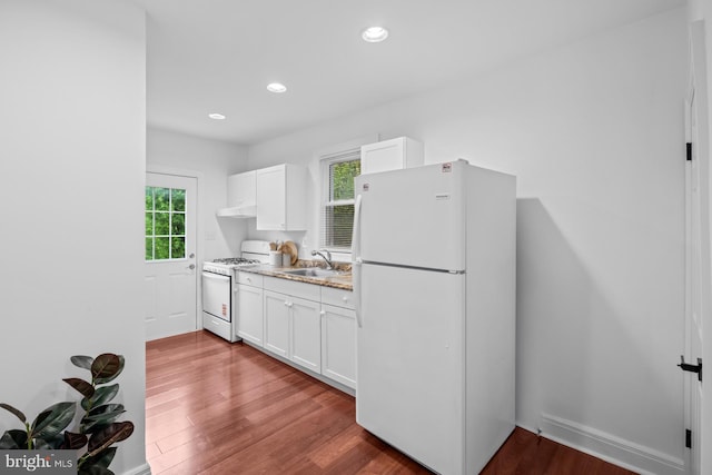 950 E W Hwy, Takoma Park, MD 20912 - kitchen featuring white appliances, wood finished floors, white cabinets, under cabinet range hood, and recessed lighting